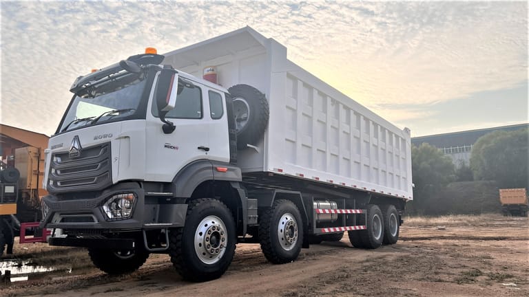 HOWO NX 400HP 8x4 Dump Truck front-left three-quarter angle showing cab and chassis design HOWO NX 400HP 8x4 Dump Truck front-left three-quarter angle showing cab and chassis design