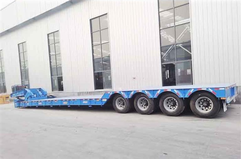 4 Axle 80 Ton RGN Low Bed Trailer Side View | Hydraulic Suspension Lowbed Trailer for Oversized Machinery 4 Axle 80 Ton RGN Low Bed Trailer Side View | Hydraulic Suspension Lowbed Trailer for Oversized Machinery