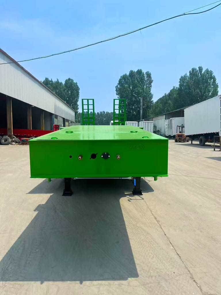 Front view of ZW Group 3 Axle 60 Ton Lowbed Semi Trailer showing reinforced gooseneck, Q345 steel chassis, and stable structure for heavy machinery transport. Front view of ZW Group 3 Axle 60 Ton Lowbed Semi Trailer showing reinforced gooseneck, Q345 steel chassis, and stable structure for heavy machinery transport.