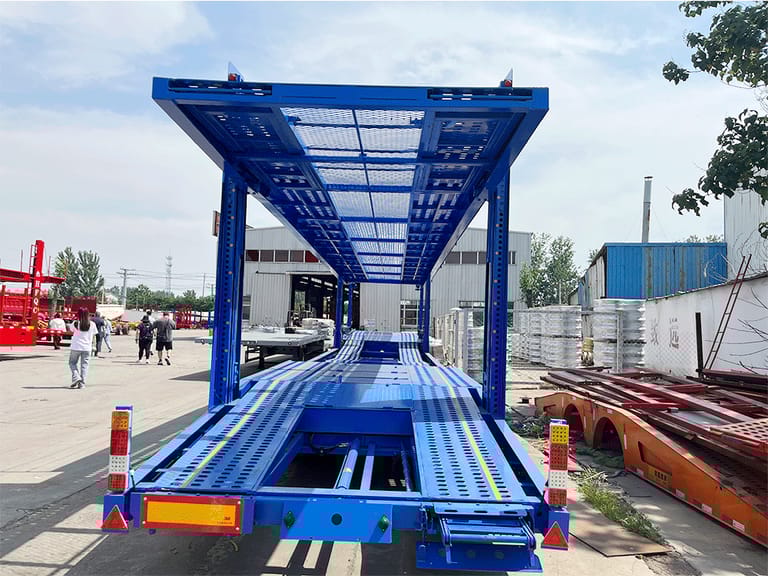 Front view of 2 Axle Car Carrier Trailer – highlighting aerodynamic front structure and reinforced chassis for reliable car transport. Front view of 2 Axle Car Carrier Trailer – highlighting aerodynamic front structure and reinforced chassis for reliable car transport.