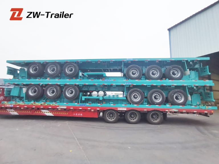 Side view of 3-Axle 40 ft Flatbed Semi-Trailer for Container & Heavy Cargo Transport — highlighting full-length steel frame, triple axles, and twist lock system for secure container transport. Side view of 3-Axle 40 ft Flatbed Semi-Trailer for Container & Heavy Cargo Transport — highlighting full-length steel frame, triple axles, and twist lock system for secure container transport.