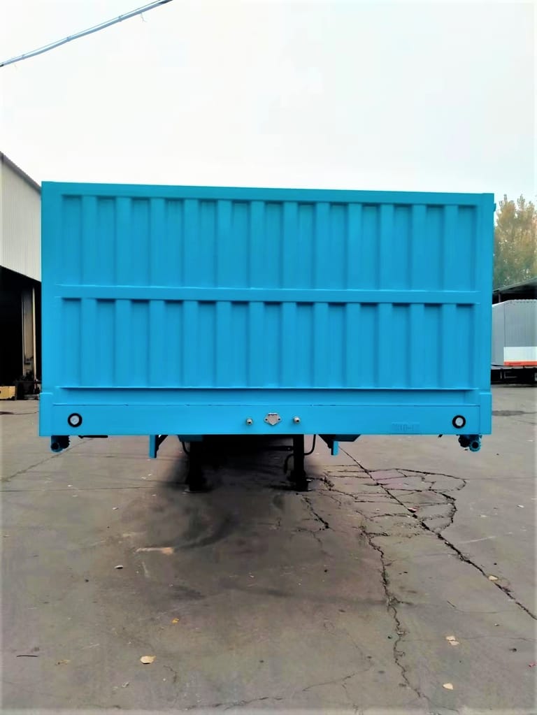 ZW Group 3 Axle 60T Side Wall Semi Trailer front view showing kingpin, landing gear, and reinforced steel chassis ZW Group 3 Axle 60T Side Wall Semi Trailer front view showing kingpin, landing gear, and reinforced steel chassis