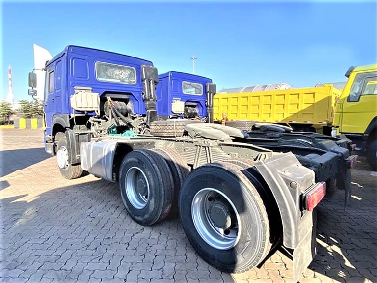 Rear 3/4 perspective of HOWO 375HP 6x4 Tractor Truck highlighting dual rear axles, multi-leaf suspension, and cargo handling capability Rear 3/4 perspective of HOWO 375HP 6x4 Tractor Truck highlighting dual rear axles, multi-leaf suspension, and cargo handling capability