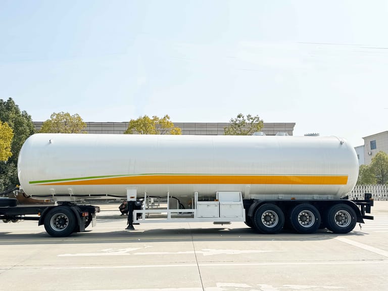 Side view of 3 Axle LPG Tanker Trailer — highlighting long cylindrical tank, triple-axle chassis, and reinforced structure for stable long-distance LPG transport. Side view of 3 Axle LPG Tanker Trailer — highlighting long cylindrical tank, triple-axle chassis, and reinforced structure for stable long-distance LPG transport.