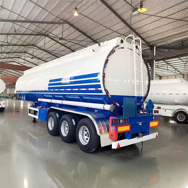 ZW Group 3 Axle 45,000L Carbon Steel Bitumen Tanker Semi Trailer – heavy-duty carbon steel tanker trailer designed for safe and efficient bitumen transport in road construction projects. ZW Group 3 Axle 45,000L Carbon Steel Bitumen Tanker Semi Trailer – heavy-duty carbon steel tanker trailer designed for safe and efficient bitumen transport in road construction projects.