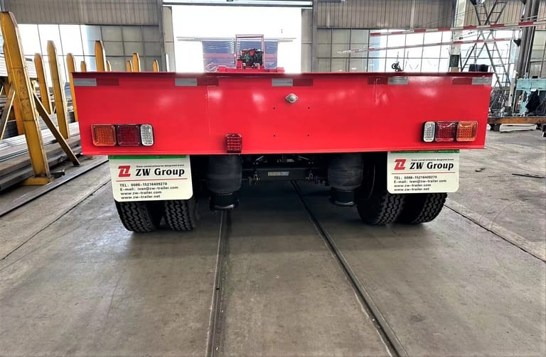 Rear view of ZW Group 3 Axle 80 Ton Removable Gooseneck Lowboy Trailer showing hydraulic ramps and landing gear Rear view of ZW Group 3 Axle 80 Ton Removable Gooseneck Lowboy Trailer showing hydraulic ramps and landing gear