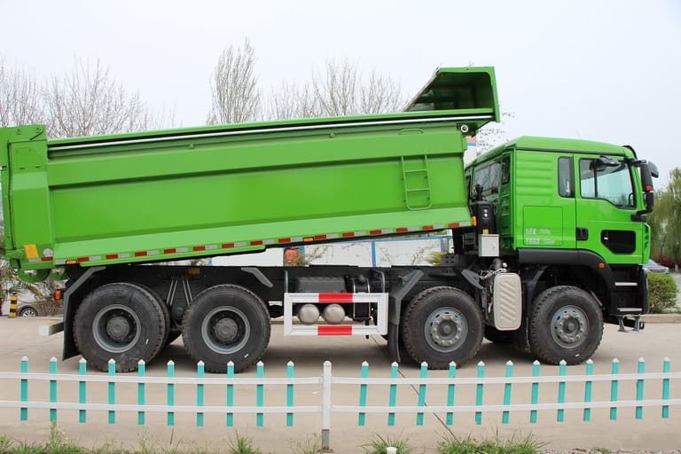 Side view of HOWO TX 460HP 8×4 Dump Truck with long wheelbase and reinforced dump body Side view of HOWO TX 460HP 8×4 Dump Truck with long wheelbase and reinforced dump body