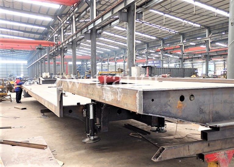 ZW Group Lowbed Trailer Production Workshop — advanced manufacturing of 2 Axle 40 Ton Lowbed Semi Trailers with strict quality inspection. ZW Group Lowbed Trailer Production Workshop — advanced manufacturing of 2 Axle 40 Ton Lowbed Semi Trailers with strict quality inspection.