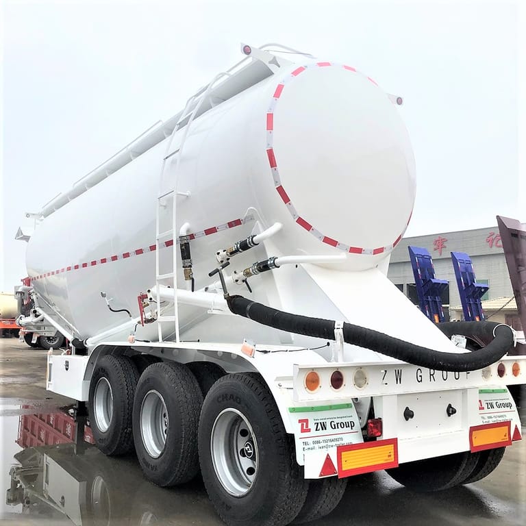 3/4 view of Dry Bulk Cement Semi Trailer – heavy-duty bulk cement transport trailer designed for safe and efficient dry cement delivery. 3/4 view of Dry Bulk Cement Semi Trailer – heavy-duty bulk cement transport trailer designed for safe and efficient dry cement delivery.