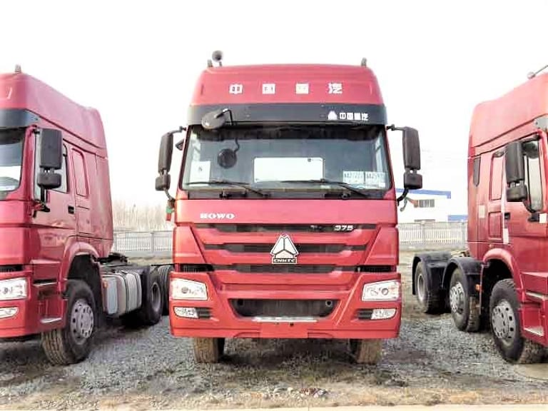 Howo 375HP 6×4 Tractor Truck front view, showing high-roof cab, robust chassis, and 6×4 drivetrain for heavy-duty long-haul transport. Howo 375HP 6×4 Tractor Truck front view, showing high-roof cab, robust chassis, and 6×4 drivetrain for heavy-duty long-haul transport.