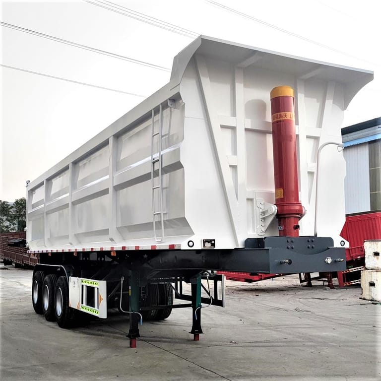 3/4 front view of 3 Axle Dump Semi Trailer – heavy-duty dump trailer designed for safe and efficient transport of bulk materials. 3/4 front view of 3 Axle Dump Semi Trailer – heavy-duty dump trailer designed for safe and efficient transport of bulk materials.