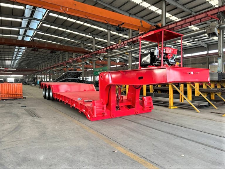 3 Axle 80 Ton Removable Gooseneck Trailer front three-quarter view showing HG60 steel frame and hydraulic gooseneck 3 Axle 80 Ton Removable Gooseneck Trailer front three-quarter view showing HG60 steel frame and hydraulic gooseneck