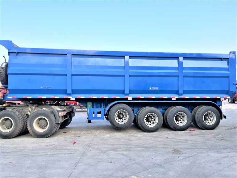 Side view of 4 Axle Dump Semi Trailer for Mining Coal – highlighting durable steel frame, U-shaped cargo bed, and four-axle design for stable heavy-load transport. Side view of 4 Axle Dump Semi Trailer for Mining Coal – highlighting durable steel frame, U-shaped cargo bed, and four-axle design for stable heavy-load transport.