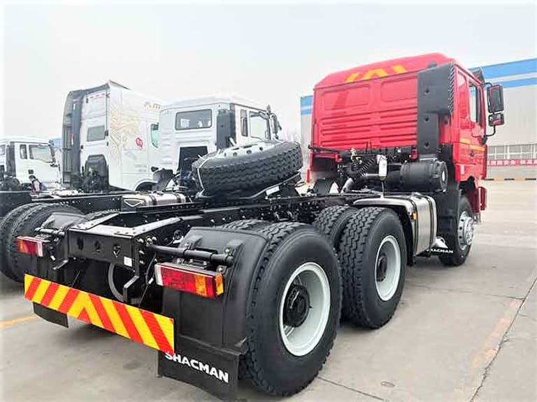 Shacman F3000 6x4 Tractor Truck rear three-quarter view highlighting chassis, rear axles, and high-capacity fuel tank for freight and logistics operations