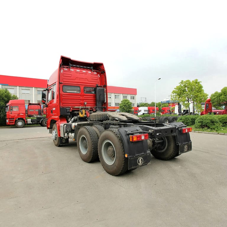 Shacman X3000 375HP 6x4 Tractor Truck rear three-quarter view showing rear axles, chassis, and fifth wheel for bulk and long-haul logistics Shacman X3000 375HP 6x4 Tractor Truck rear three-quarter view showing rear axles, chassis, and fifth wheel for bulk and long-haul logistics
