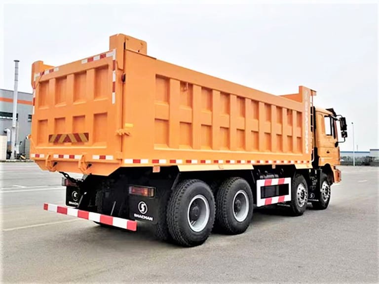 Shacman F3000 8x4 400HP dump truck rear three-quarter angle highlighting hydraulic lift and tailgate