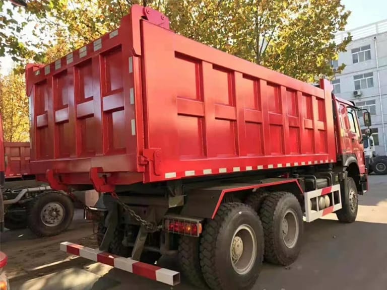 HOWO 336HP 6×4 dump truck rear three-quarter view highlighting steel dump body, rear axle assembly, and hydraulic lifting mechanism HOWO 336HP 6×4 dump truck rear three-quarter view highlighting steel dump body, rear axle assembly, and hydraulic lifting mechanism