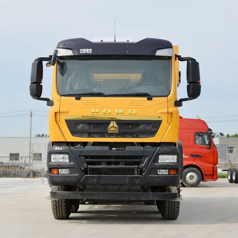 HOWO TX 8x4 440HP dump truck front view showing cabin and reinforced chassis for heavy-duty construction HOWO TX 8x4 440HP dump truck front view showing cabin and reinforced chassis for heavy-duty construction