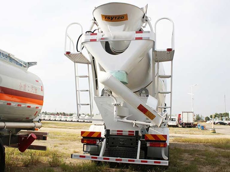 Rear view of HOWO 380HP 8×4 Concrete Mixer Truck showing drum discharge chute, rear axles, and stabilizing components Rear view of HOWO 380HP 8×4 Concrete Mixer Truck showing drum discharge chute, rear axles, and stabilizing components