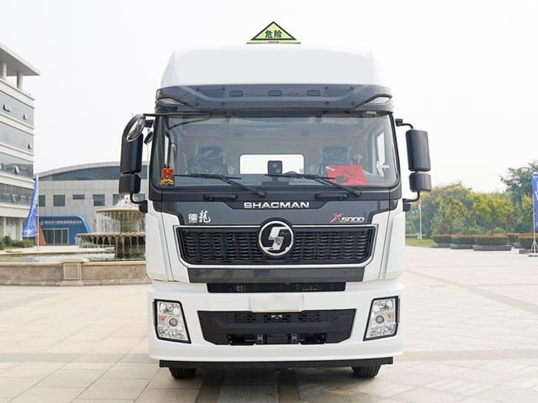 Shacman X5000 460HP 6x4 Tractor Truck front view showing high-roof sleeper cab, reinforced chassis, and heavy-duty tires for hazardous goods and long-haul logistics