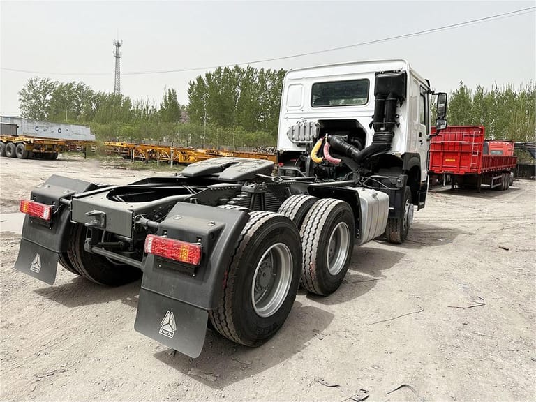HOWO 371HP 6×4 Tractor Truck rear 3/4 view showing dual rear axles, fifth wheel coupling, and reinforced chassis designed for container and cargo hauling