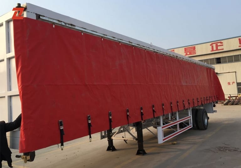 Front 3/4 view of ZW Enclosed Curtain Side Semi Trailer with reinforced chassis and sliding curtains Front 3/4 view of ZW Enclosed Curtain Side Semi Trailer with reinforced chassis and sliding curtains