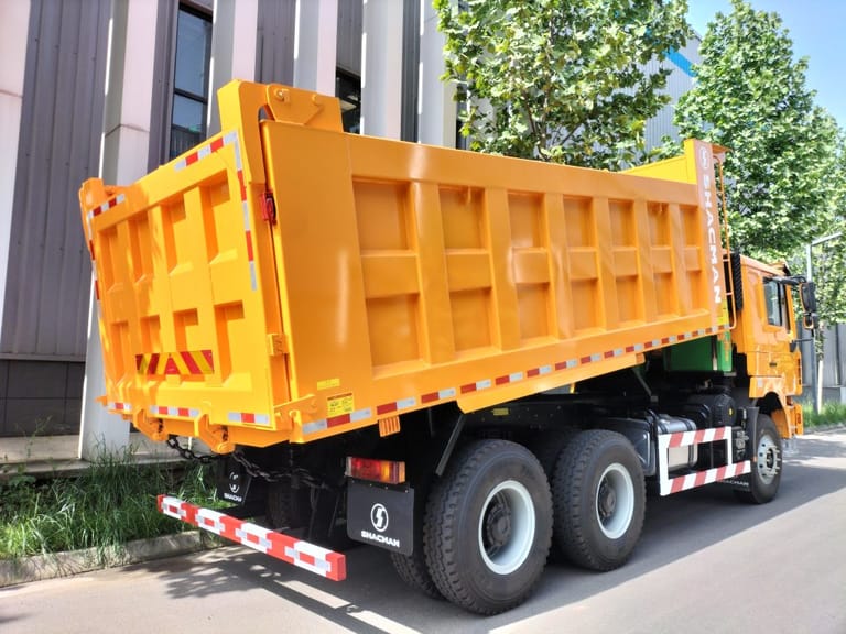 Shacman F3000 430HP 6x4 dump truck rear 3/4 view highlighting hydraulic lift cargo body, dual rear axles, and robust suspension system Shacman F3000 430HP 6x4 dump truck rear 3/4 view highlighting hydraulic lift cargo body, dual rear axles, and robust suspension system