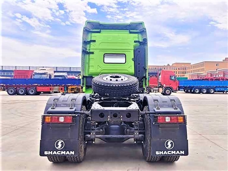 Shacman X3000 430HP 6x4 Tractor Truck rear view highlighting MAN rear axles, fifth wheel, and chassis for bulk cargo and construction transport