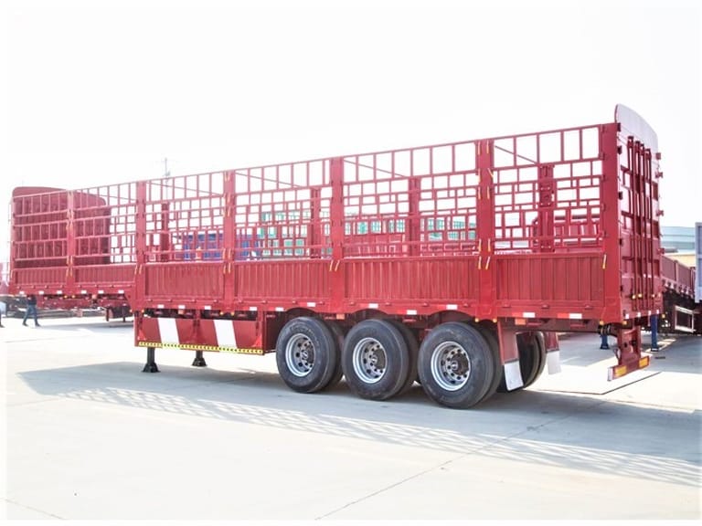 Side view of 3 Axle Cargo Fence Trailer – highlighting strong frame, side fences, and three-axle configuration for stable and reliable cargo transport. Side view of 3 Axle Cargo Fence Trailer – highlighting strong frame, side fences, and three-axle configuration for stable and reliable cargo transport.