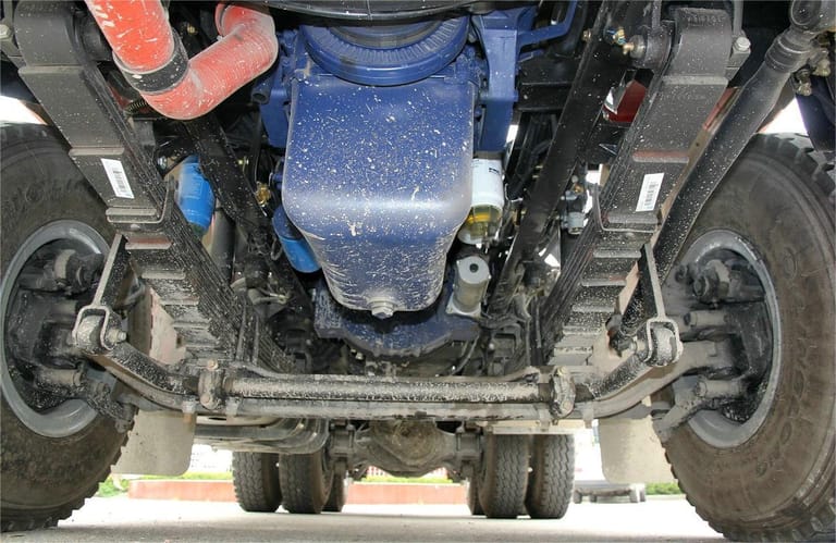 Shacman X3000 375HP 6x4 Tractor Truck chassis view showing reinforced steel frame, 13T MAN rear axles, and suspension system for heavy-duty transport Shacman X3000 375HP 6x4 Tractor Truck chassis view showing reinforced steel frame, 13T MAN rear axles, and suspension system for heavy-duty transport