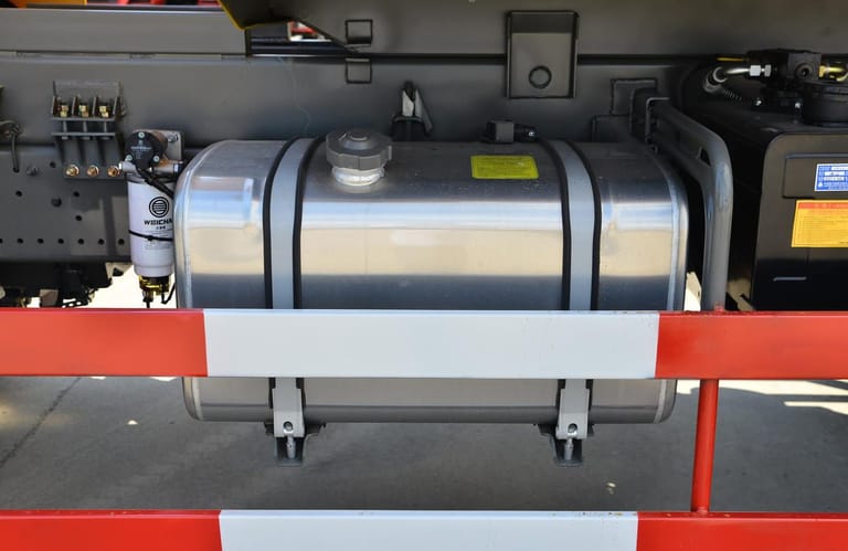 HOWO TX 400HP dump truck aluminum fuel tank close-up showing 400L capacity and reinforced mounting brackets HOWO TX 400HP dump truck aluminum fuel tank close-up showing 400L capacity and reinforced mounting brackets