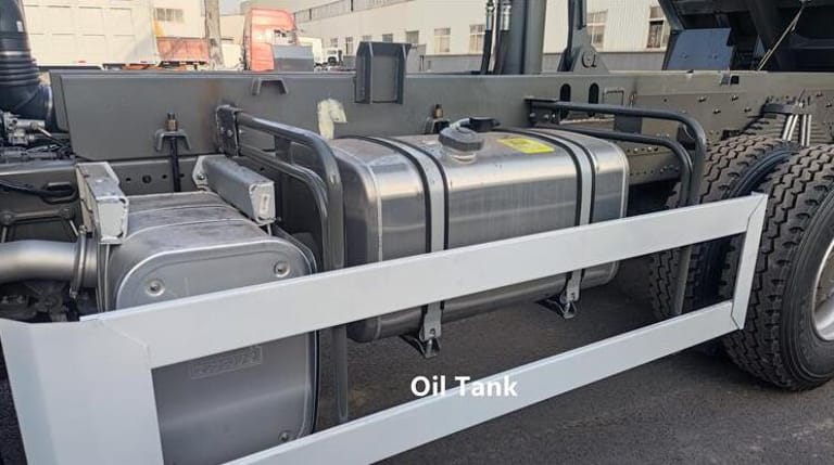 ChatGPT 说：  Close-up of HOWO 380HP 8x4 dump truck fuel tank, 400-liter aluminum alloy, designed for long-distance heavy-duty operations