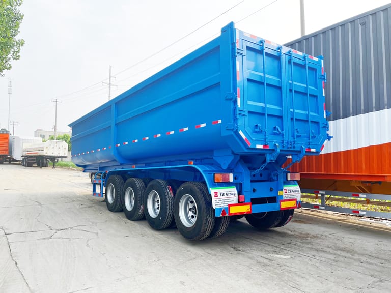 3/4 rear view of 4 Axle Tipper Semi Trailer – showing reinforced chassis, large tipper body, and hydraulic system for efficient unloading. 3/4 rear view of 4 Axle Tipper Semi Trailer – showing reinforced chassis, large tipper body, and hydraulic system for efficient unloading.