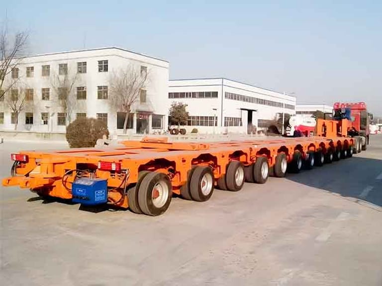 3/4 rear angle view of ZW Group Goldhofer Hydraulic Modular Trailer demonstrating modular flexibility 3/4 rear angle view of ZW Group Goldhofer Hydraulic Modular Trailer demonstrating modular flexibility