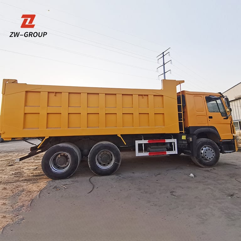 Side view of used HOWO 371HP 6x4 Dump Truck showing cargo body, wheels, and chassis Side view of used HOWO 371HP 6x4 Dump Truck showing cargo body, wheels, and chassis