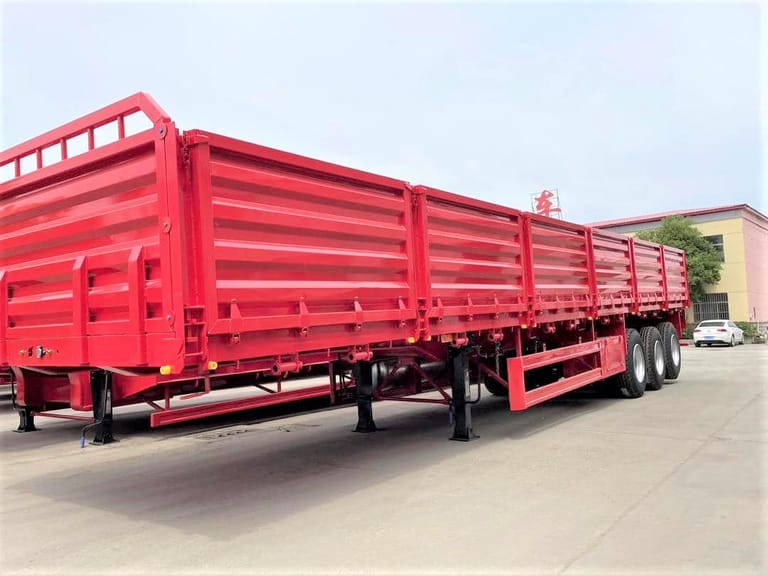3 Axle 60T Side Board Trailer front three-quarter view showing high-strength chassis, 1200mm side boards, and mechanical suspension 3 Axle 60T Side Board Trailer front three-quarter view showing high-strength chassis, 1200mm side boards, and mechanical suspension