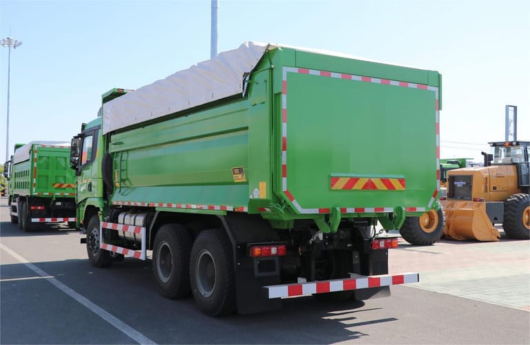 Shacman X3000 6x4 dump truck rear three-quarter angle highlighting hydraulic tipping system Shacman X3000 6x4 dump truck rear three-quarter angle highlighting hydraulic tipping system