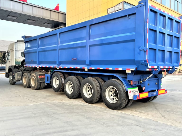 3/4 rear view of 4 Axle Dump Semi Trailer for Mining Coal – showing reinforced chassis, large-capacity dump body, and hydraulic system for efficient coal unloading. 3/4 rear view of 4 Axle Dump Semi Trailer for Mining Coal – showing reinforced chassis, large-capacity dump body, and hydraulic system for efficient coal unloading.