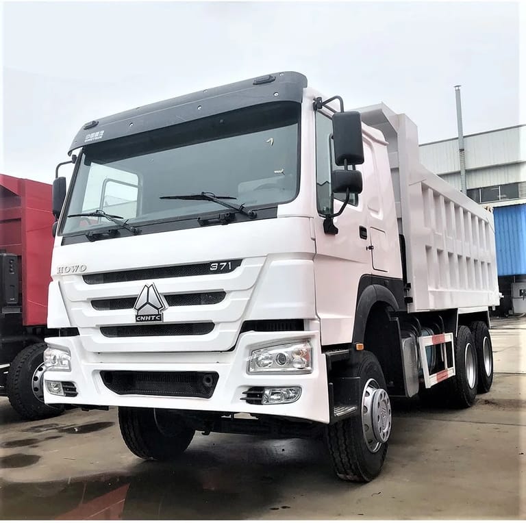 HOWO 371HP 6×4 Dump Truck front close up showing grille headlights and bumper HOWO 371HP 6×4 Dump Truck front close up showing grille headlights and bumper