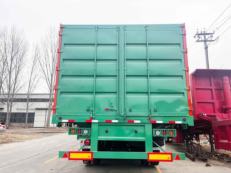 6-Axle 100 Ton Cargo Transport Fence Semi-Trailer Rear View — showing the strong steel frame, dual rear doors, and reinforced fence structure for high-capacity cargo transport.