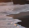 ocean waves crashing on shore during daytime