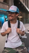 man in white crew neck t-shirt wearing blue cap and black sunglasses