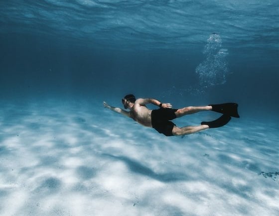 woman in black bikini in water