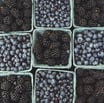 black berries on black surface
