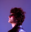 woman in black shirt wearing sunglasses