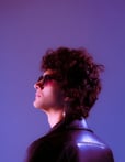 woman in black shirt wearing sunglasses