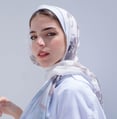 woman in white hijab smiling