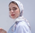 woman in white hijab smiling