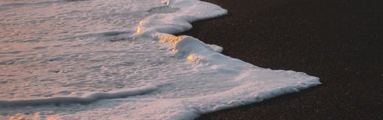ocean waves crashing on shore during daytime