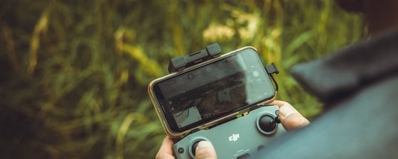 person holding black and gray digital camera